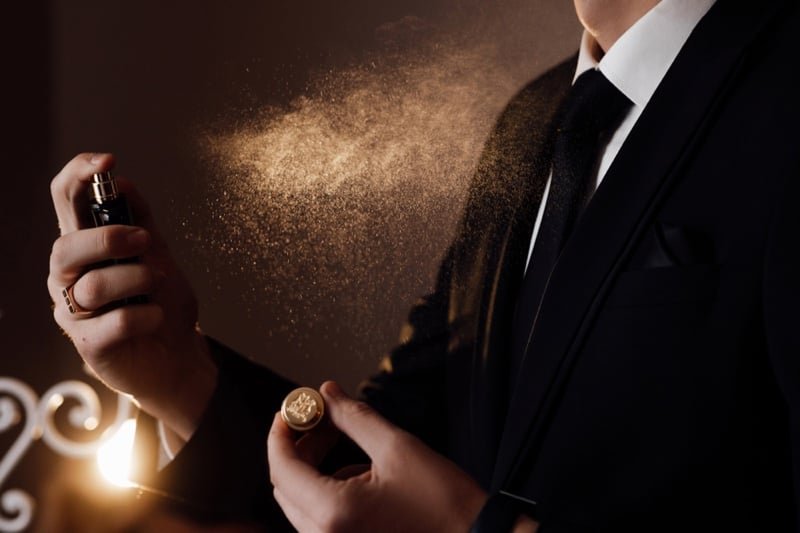 Suit-Wearing-Man-Spraying-Cologne-Fragrance.jpg Suit-Wearing-Man-Spraying-Cologne-Fragrance.jpg